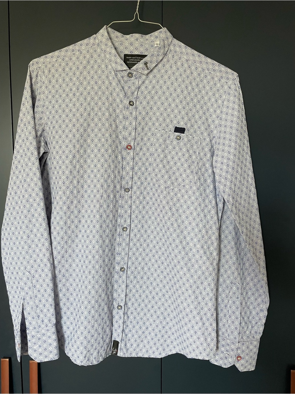 Casual button down.  Blue patterned shirt.